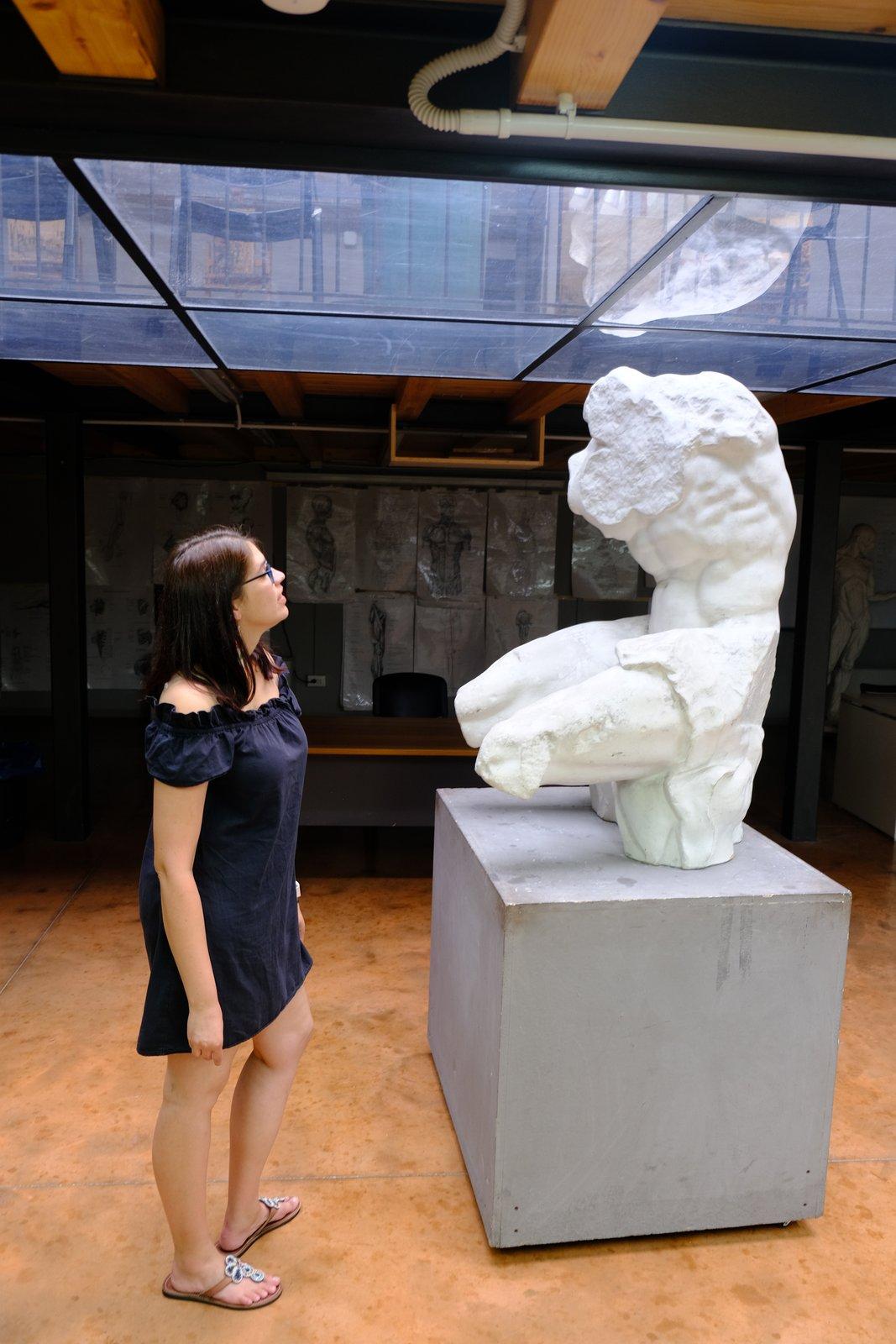 Studying a plaster cast of a classical sculpture